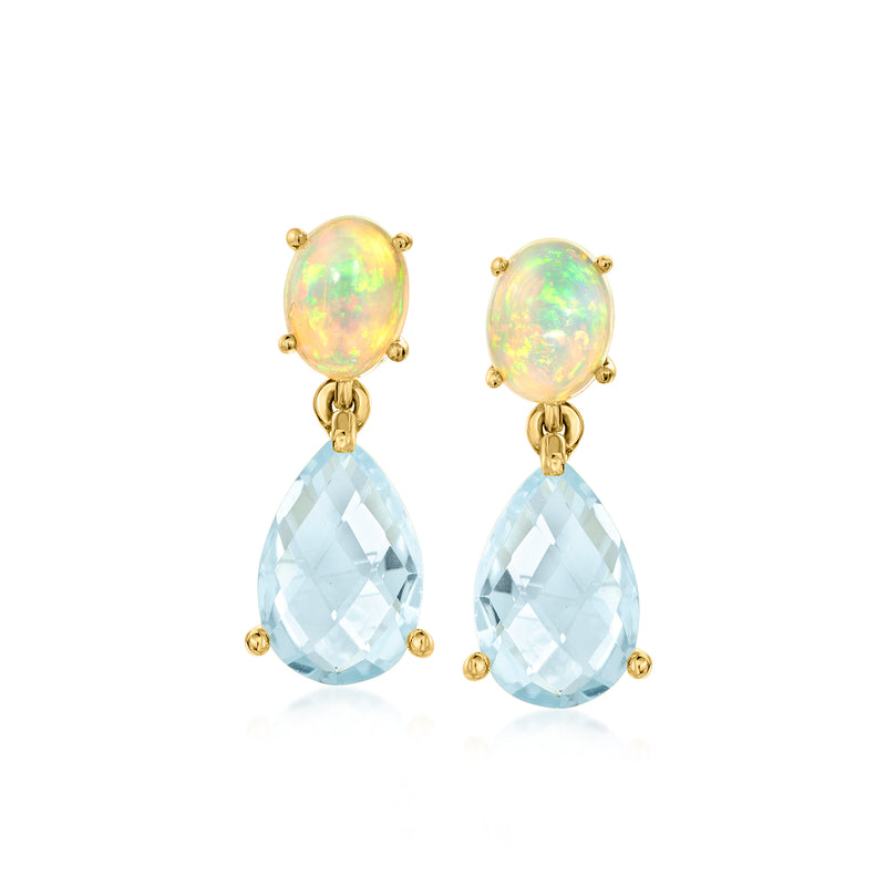 Gold drop earrings with opal-like oval studs and sky-blue teardrop dangles