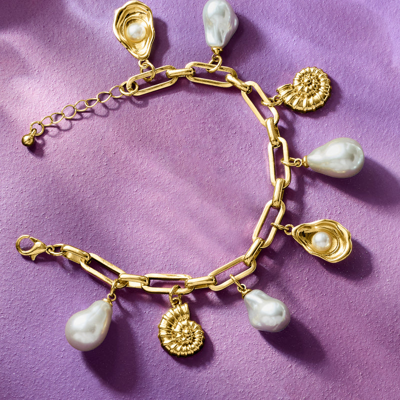 Gold-toned link bracelet with white baroque pearl and seashell charm drops
