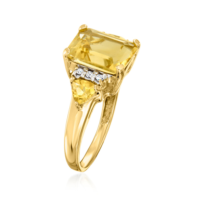 Yellow gold ring with cushion-cut yellow gemstone center and diamond accents
