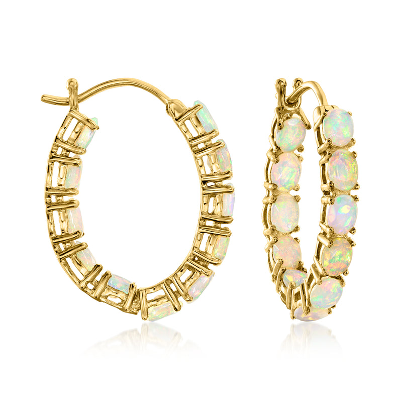 18kt gold hoop earrings with opal-like stones in inside-out setting, round hoop design