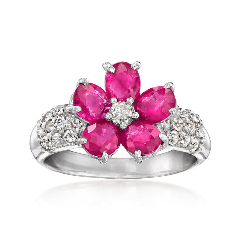 Ruby flower ring in white gold with three oval pink stones and diamond accents
