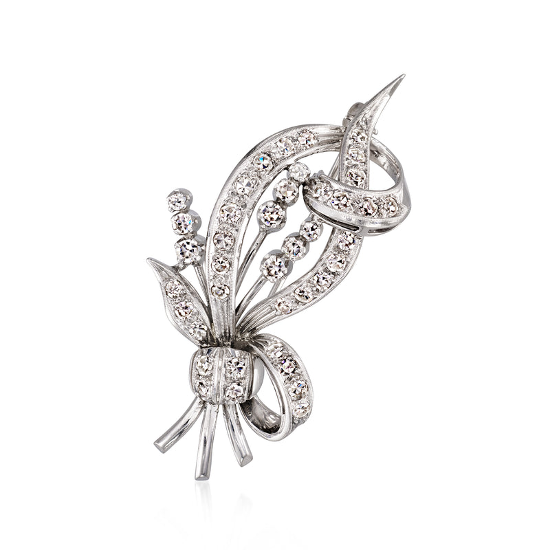 Diamond bouquet pin in white gold, floral ribbon and leaf shapes with sparkling stones