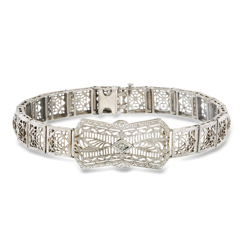 Vintage white gold openwork bracelet with single diamond center