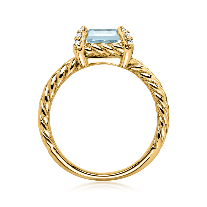 Gold tone braided band ring with sky blue center stone and white side accents