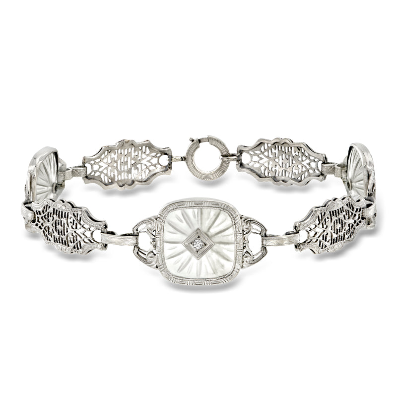 Platinum openwork station bracelet with crystal cabochons and diamond accents, oval center