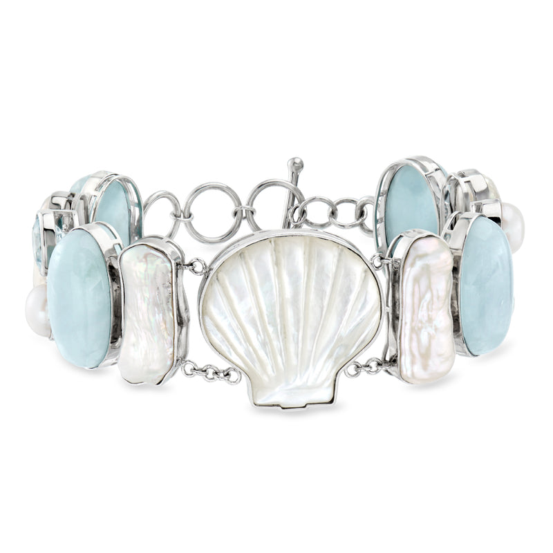 Sterling silver sea life bracelet with mother-of-pearl shell center and blue gemstone panels