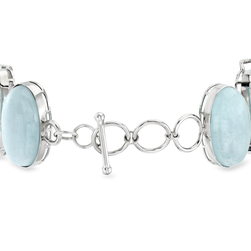 Sterling silver bracelet with large blue oval stone links and mother-of-pearl side pieces