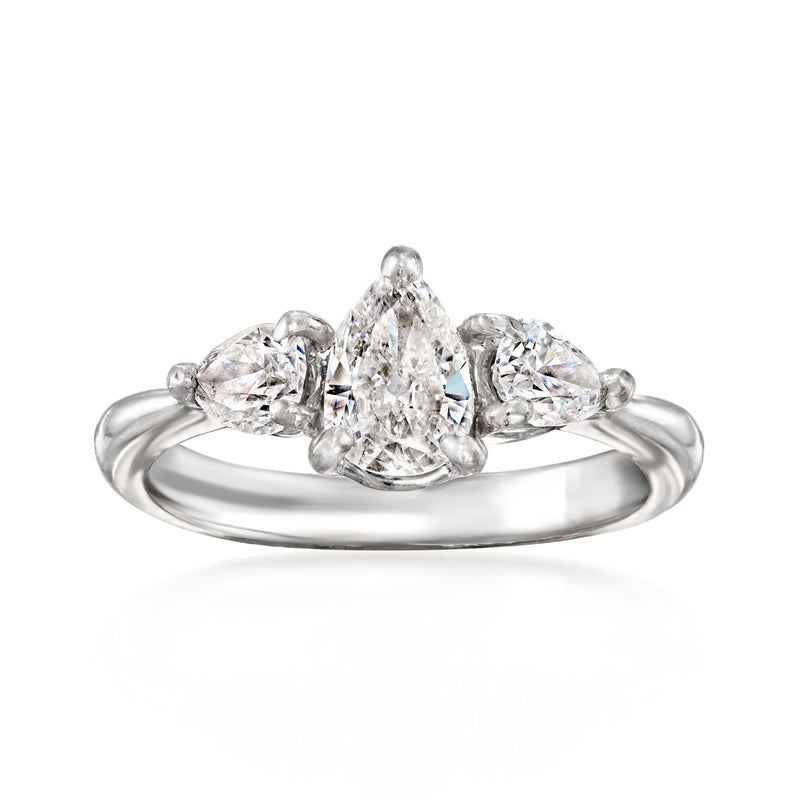 Platinum pear-shaped diamond three-stone vintage ring with side diamonds