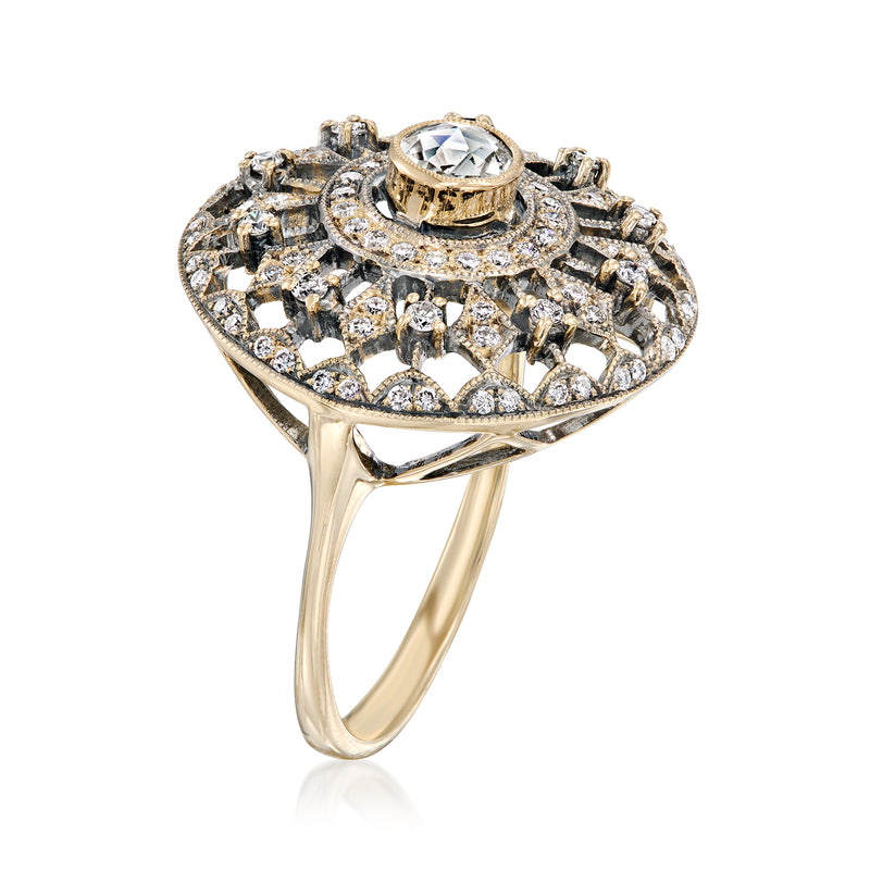 Diamond openwork ring side view with round center stone in 18kt yellow gold