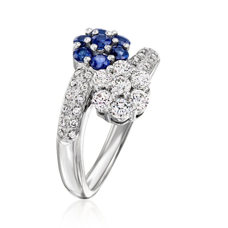 White gold ring with blue sapphire cluster on top and diamond bypass bands