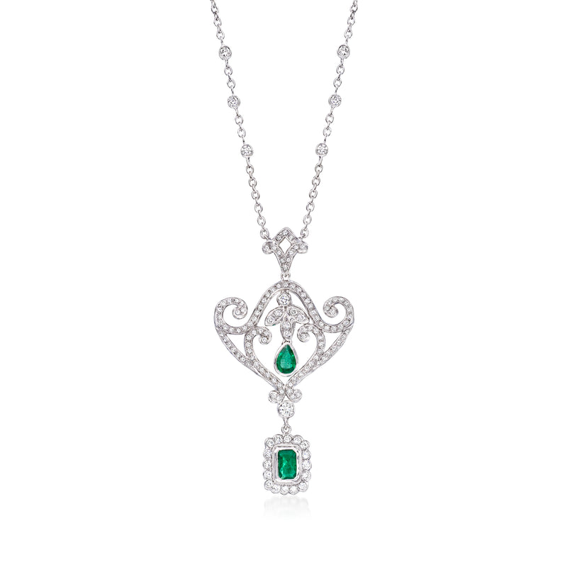 18kt white gold drop necklace with diamond filigree and two green emerald accents