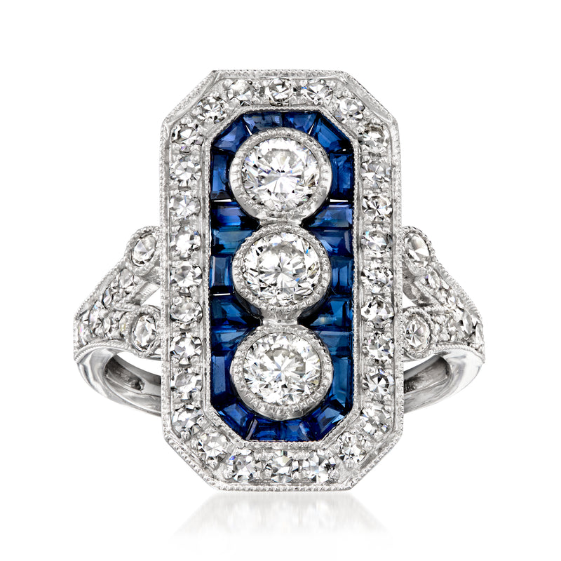 Platinum vintage ring with oval center diamond, blue sapphires, and diamond halo