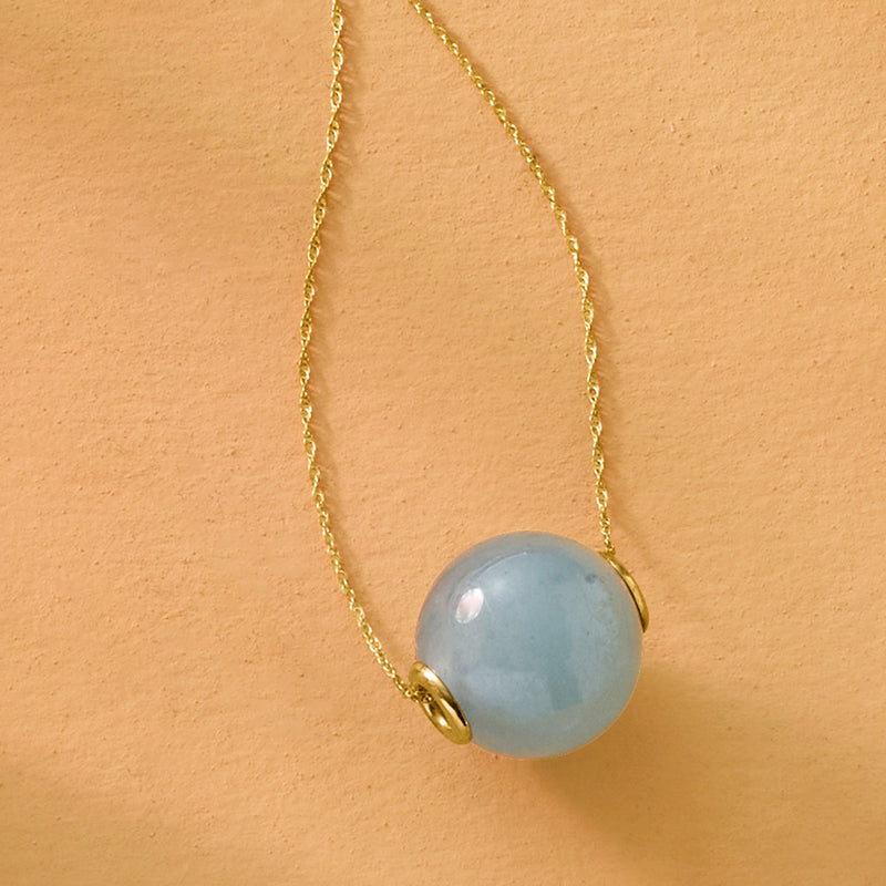 Aquamarine bead pendant with gold bail on slender gold chain