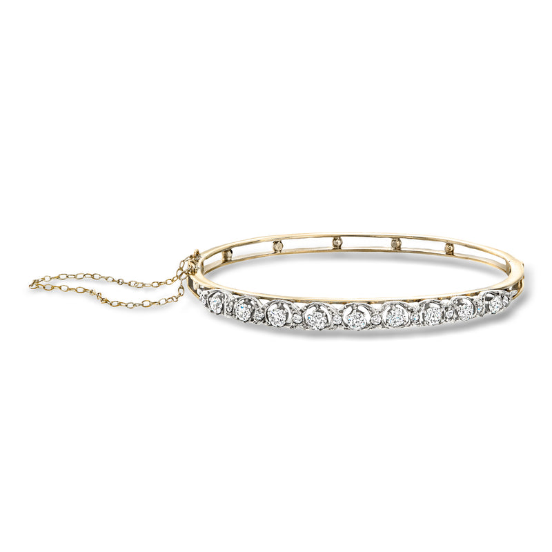 Diamond bangle bracelet with platinum setting, pave stones, hinged design and chain extender