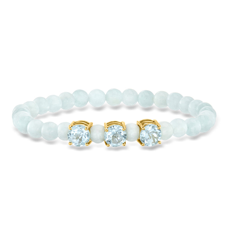 Light blue bead stretch bracelet with three gold-set oval sky blue stones