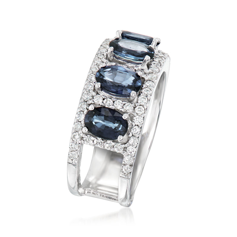 Blue sapphire and diamond band ring with oval stones in a white halo setting