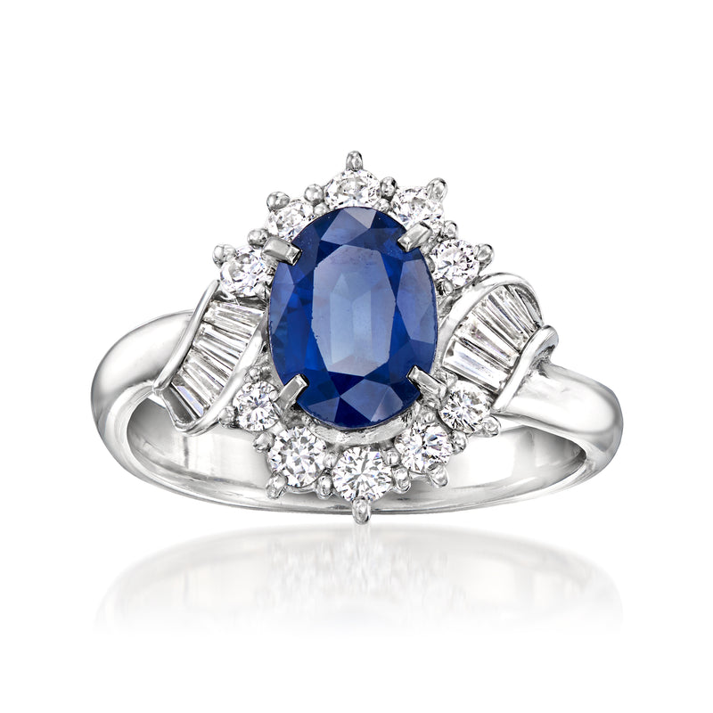 Platinum vintage sapphire and diamond ring, oval blue center with halo and baguette accents