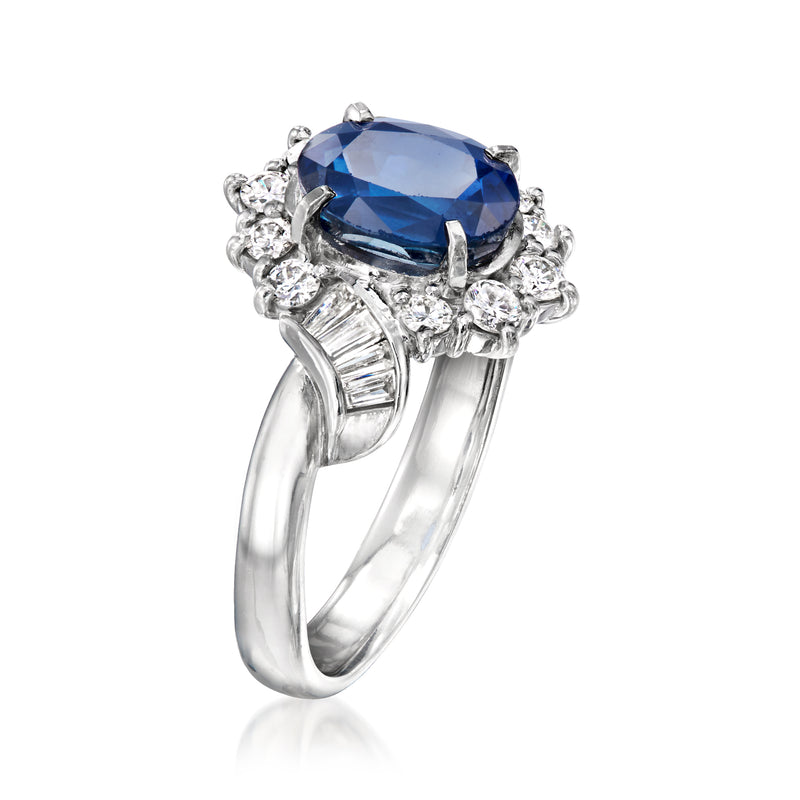 Platinum sapphire and diamond ring, blue oval center with split shank and round diamond halo
