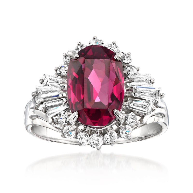 Platinum oval rhodolite garnet ring with diamond halo and baguette accents