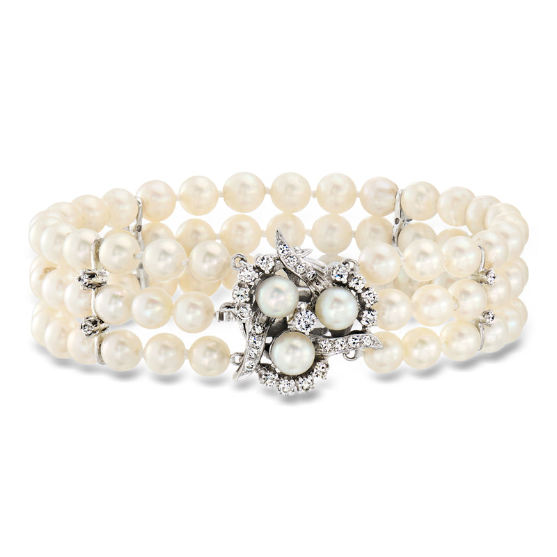 Three-row cultured pearl bracelet with sparkling diamond-look clasp in white metal