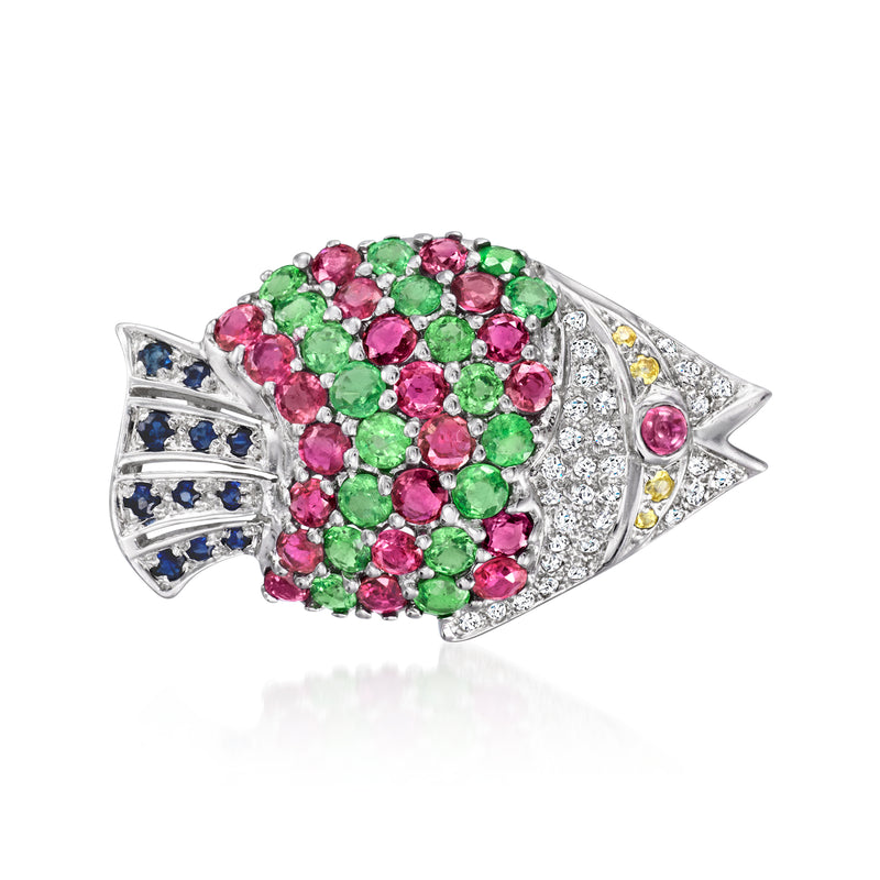 Fish-shaped pin in 18kt white gold with pink, green, and clear gemstones and diamonds