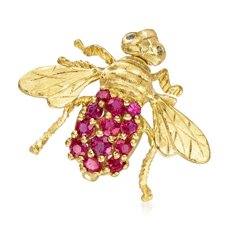 Gold bee lapel pin with pink gemstone body and detailed wings.