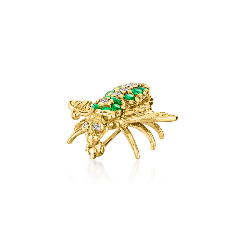 Gold-tone bee pin angled view with emerald-green cluster stones and clear diamonds