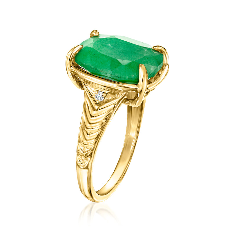 Gold ring with green cushion gemstone and triangular diamond halo, angled view