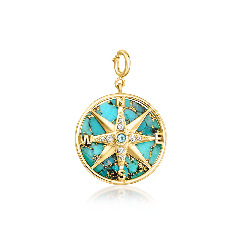 Gold compass charm with turquoise enamel dial, crystal star details, and top loop.