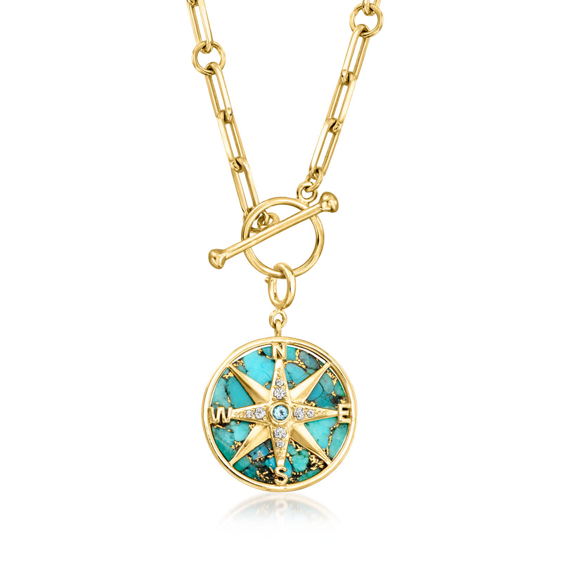 Gold chain necklace featuring round compass charm with turquoise enamel dial and crystals.