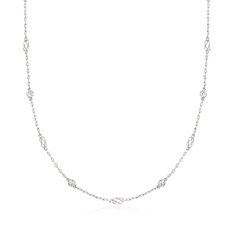 Platinum diamond station necklace with round gemstones along a fine chain