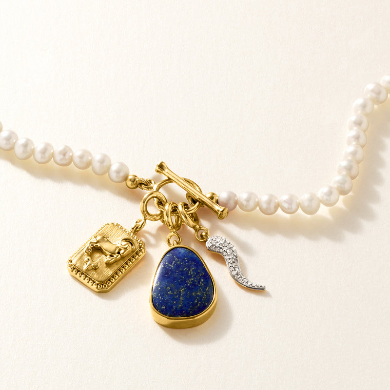 Pearl jewelry with gold lapis teardrop charm pendant
