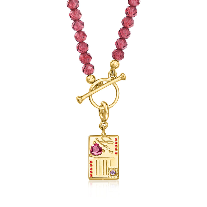 Gold Paris postcard charm with pink gemstones and toggle clasp on red beaded necklace