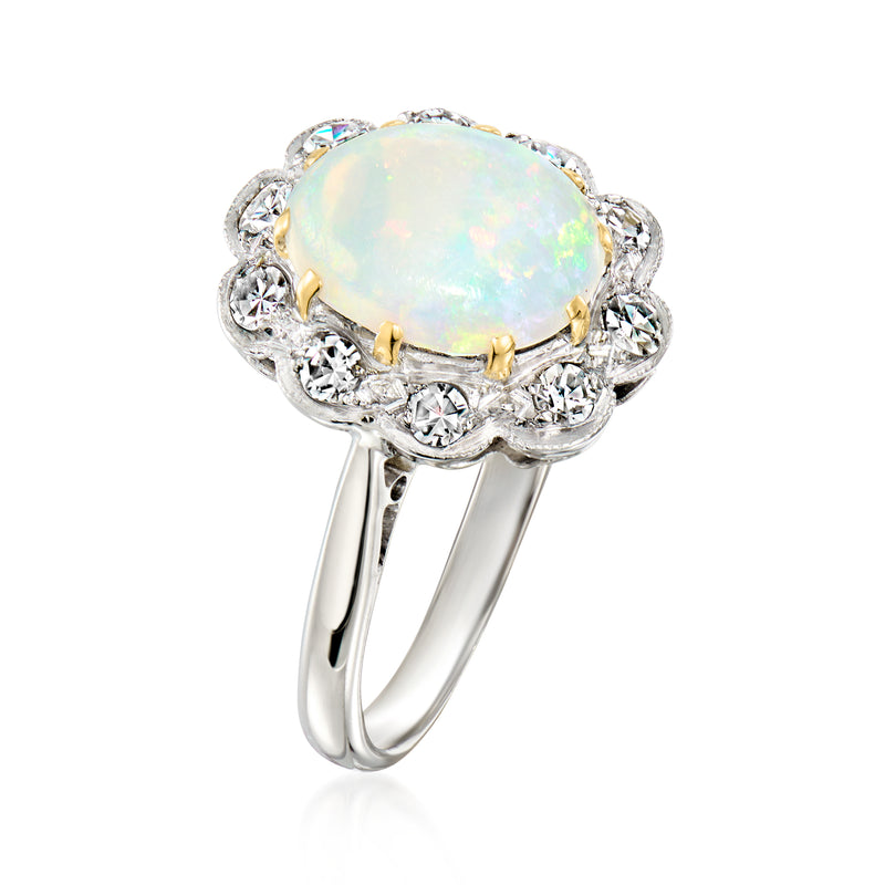 Vintage opal ring with oval opal and diamond halo, side view of prongs and band