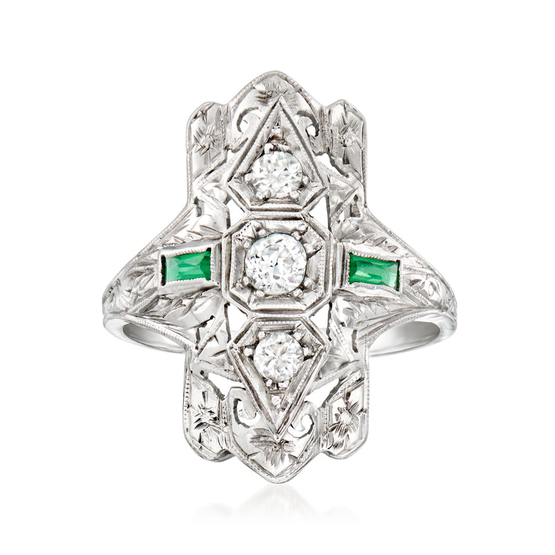 Vintage white gold filigree ring with clear stones and green emerald accents