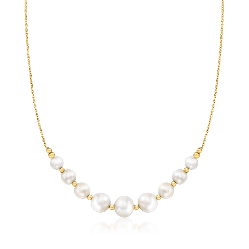 Graduated pearl station necklace with gold chain and round white cultured pearls