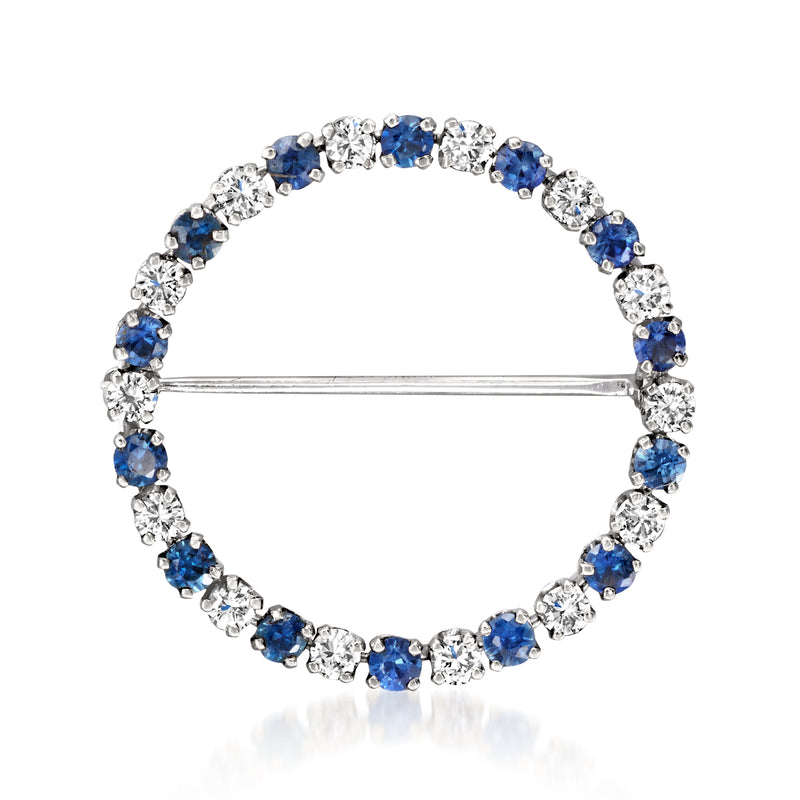 Diamond and sapphire circle pin with open center, set in white gold