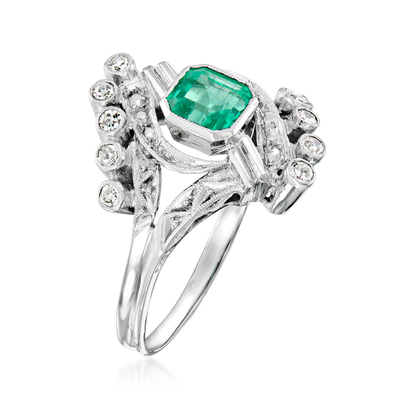 Vintage white-gold ring with emerald-green center stone and round diamond accents