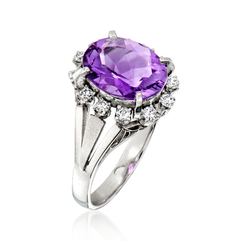 Oval purple amethyst ring with prong-set diamonds and split shank