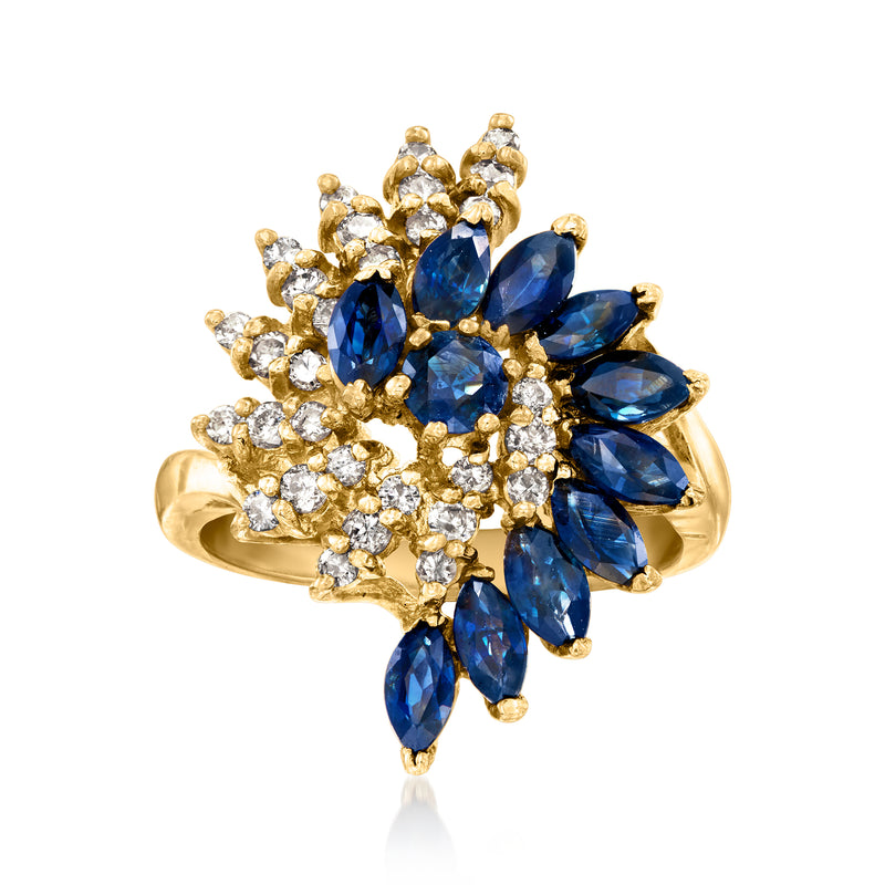 14kt yellow gold swirl ring with blue sapphire marquise and white diamond halo