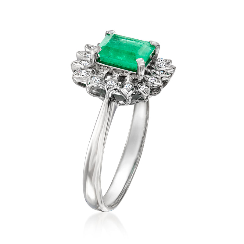 Platinum emerald-cut center ring with diamond cluster shoulders and split band