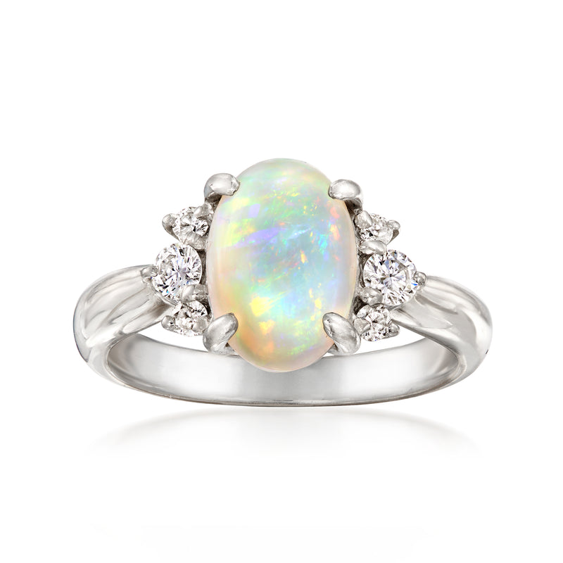 Vintage opal diamond ring in platinum with oval opal center and round diamond accents