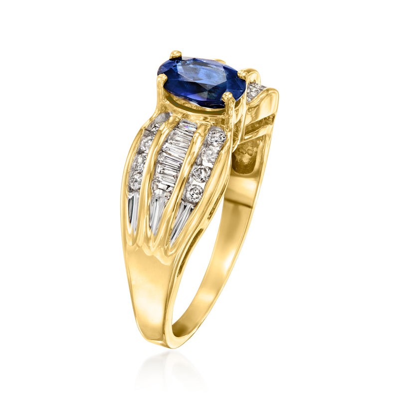 Side view of 18kt yellow gold ring with oval blue sapphire and row of diamonds