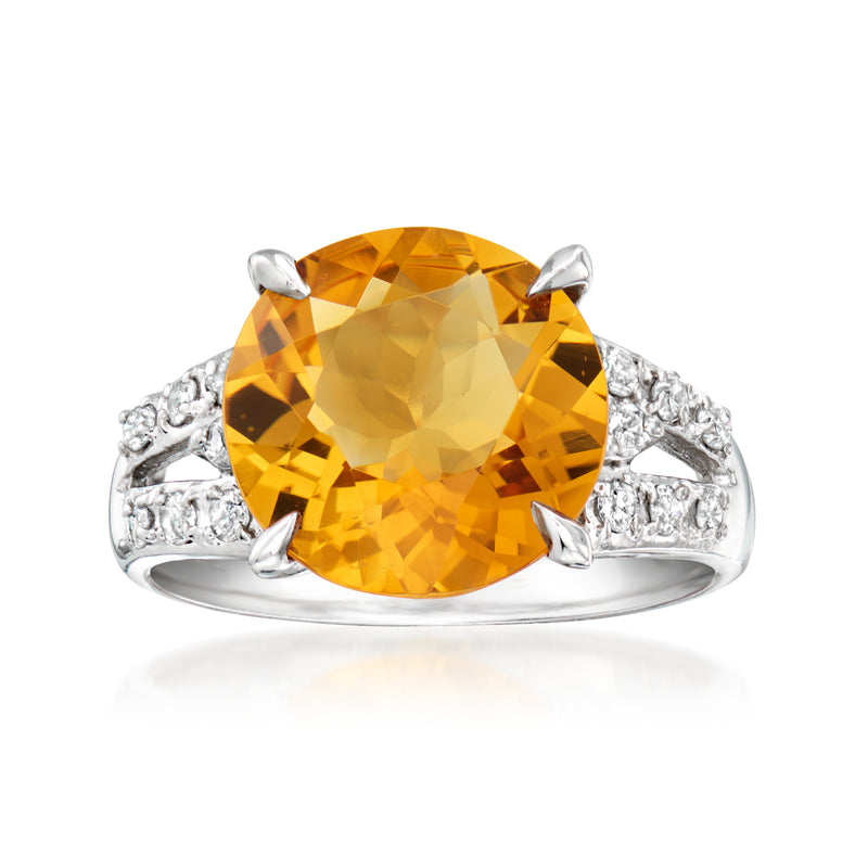 Platinum ring with oval citrine center and diamond side accents, size 6.5