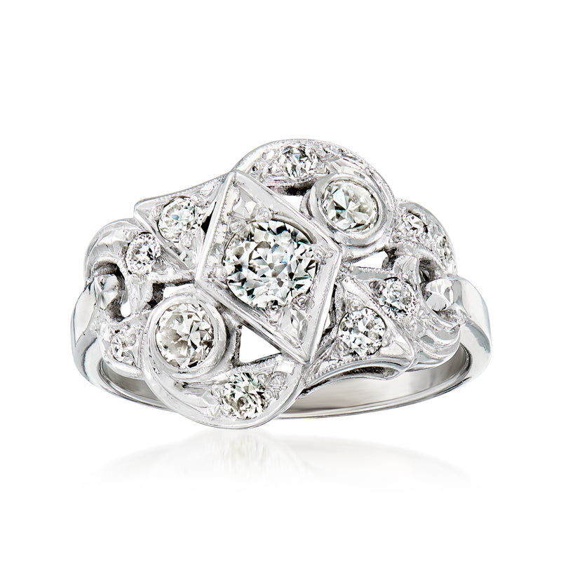 Vintage geometric diamond ring in white gold with oval and round stones, high shine