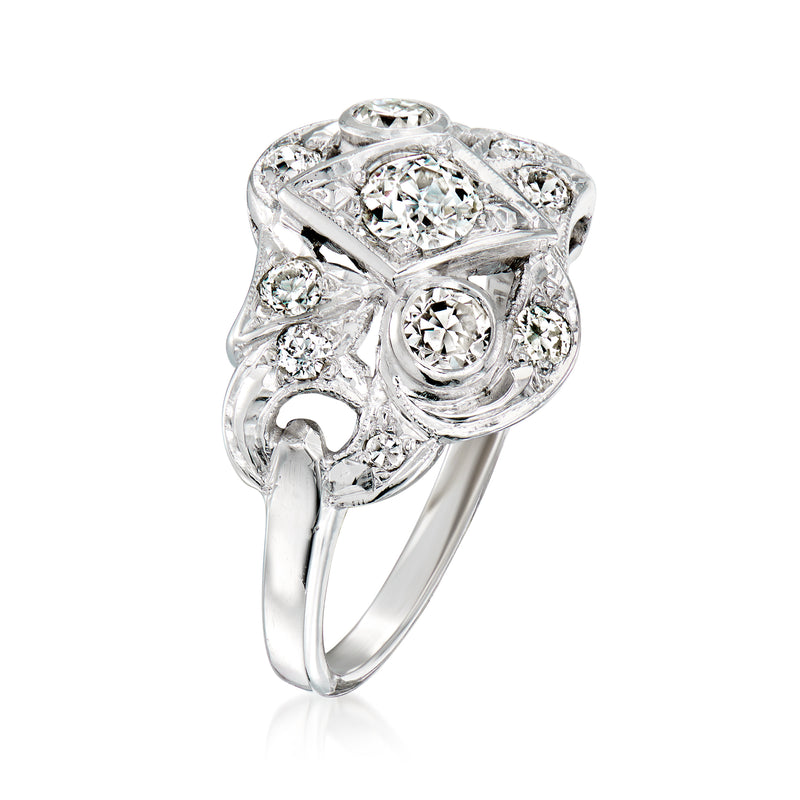 Vintage white gold diamond geometric ring with oval center and round side stones
