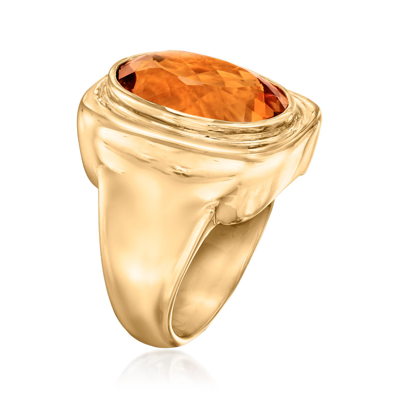 Vintage yellow gold ring with oval orange gemstone, curved rope bezel setting