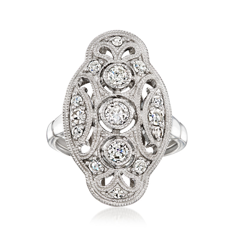 Vintage platinum diamond ring with oval filigree setting and round center stones