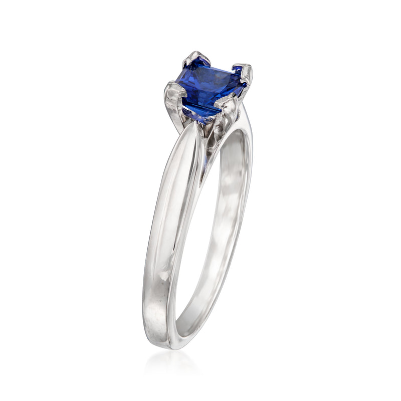 Vintage ring view with square-cut blue sapphire in prong-set white metal