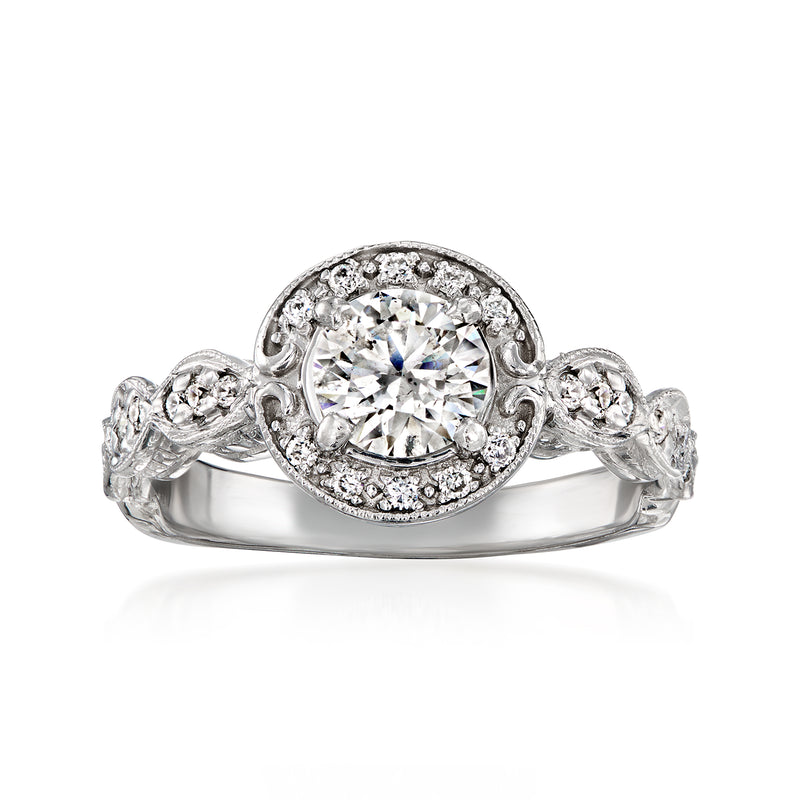 Vintage 14kt white gold diamond ring with round center stone and halo